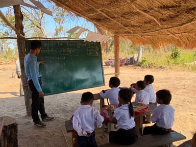 Children learning together at a community camp
