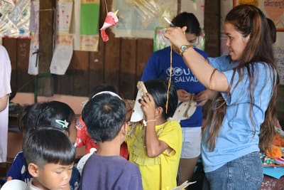 A teacher working with students