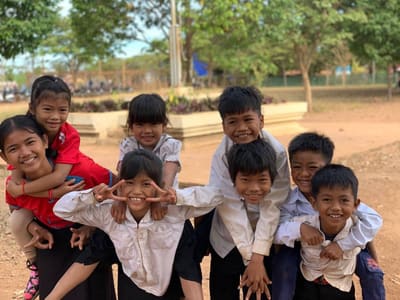 Children playing outdoors in a rural Cambodian community