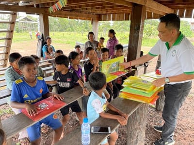 Students with their school supplies in a classroom